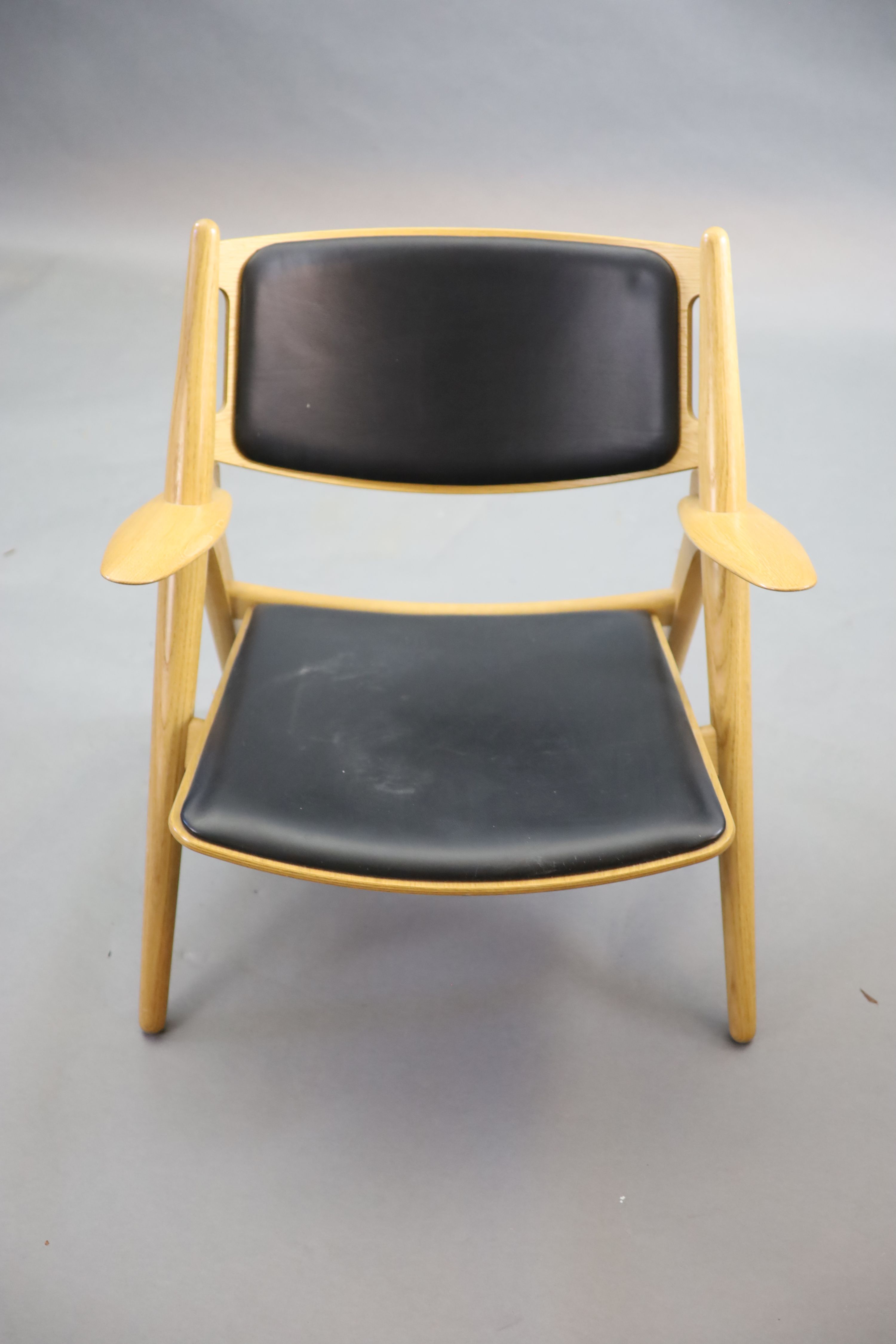 Hans Wegner for Carl Hansen, an oak and oak laminate framed ‘Sawback’ armchair, 73cm high, 52cm deep, 76cm high